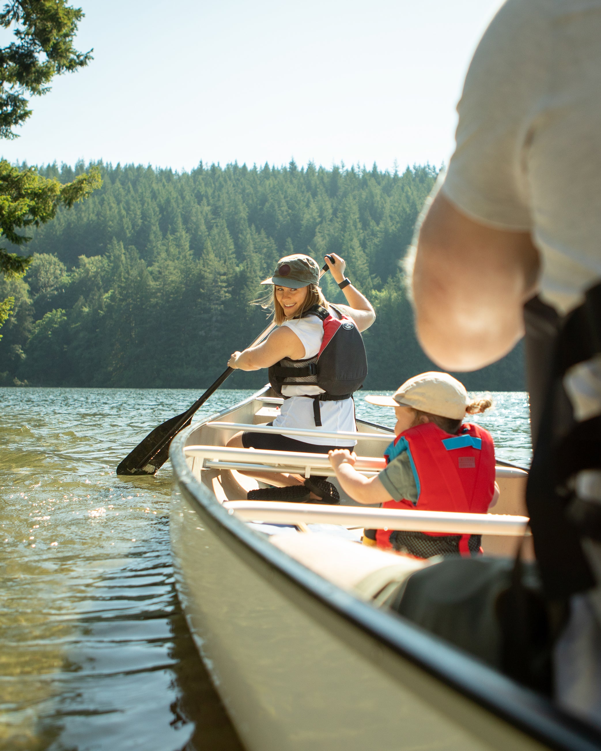 Young family canoeing on a lake